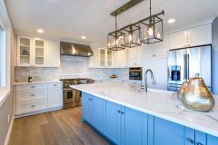Beautiful white kitchen with large marble island.